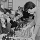 Nona Gaprindashvili playing chess against 28 at once men in 1965.
